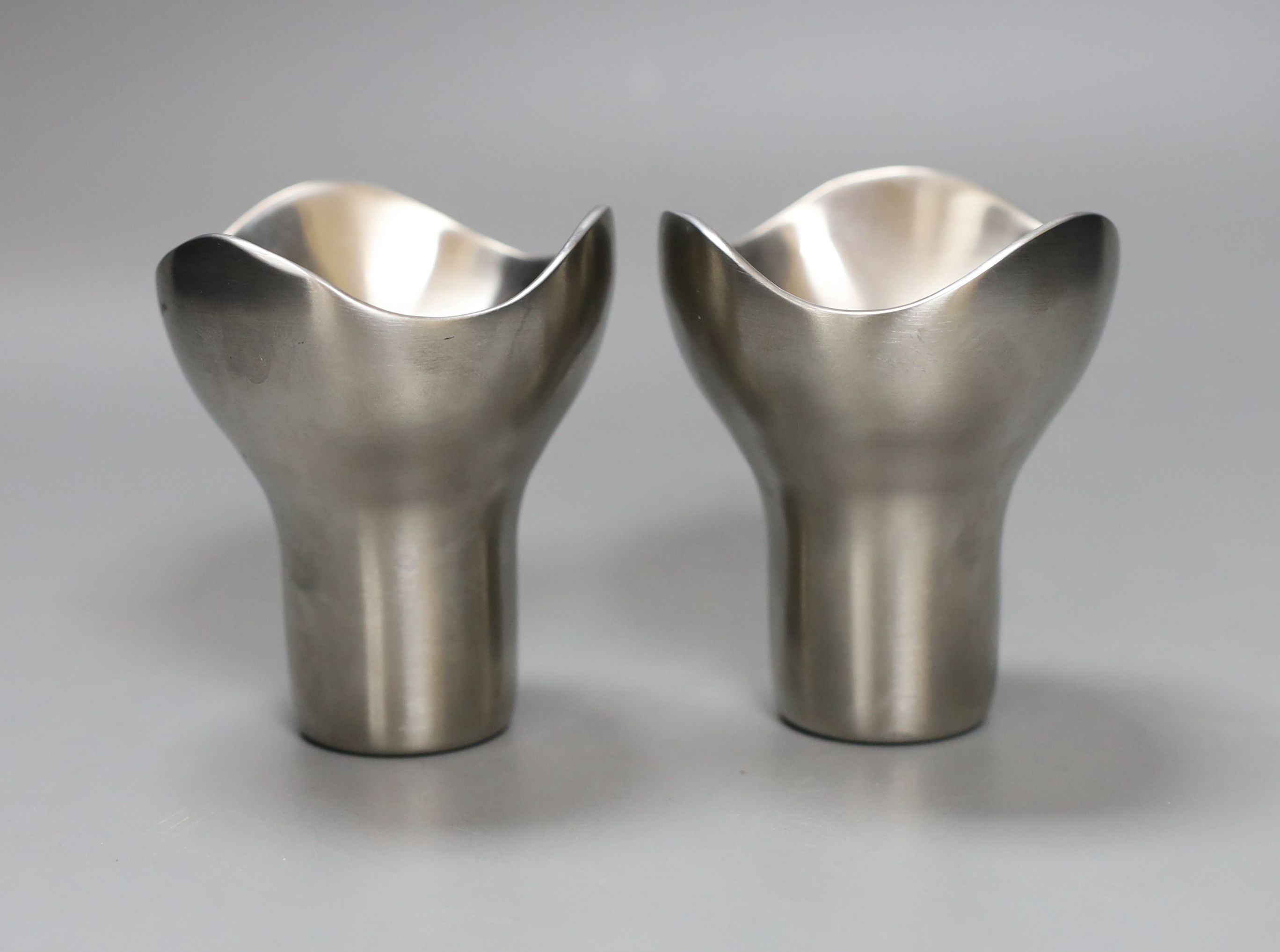 A pair of small steel George Jensen candlesticks 8cm